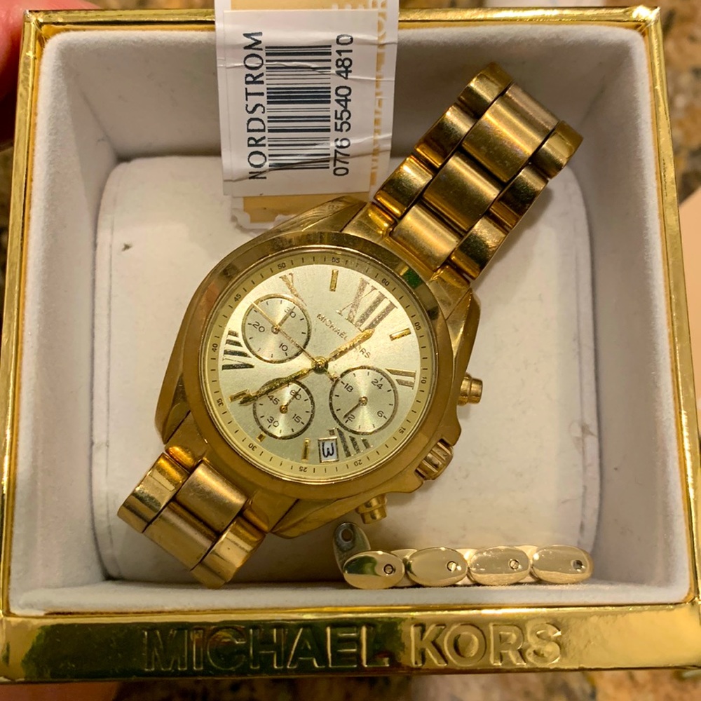 Michael Kors gold women’s watch.